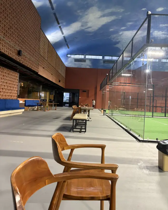 A court beside the brick wall with rattan chairs